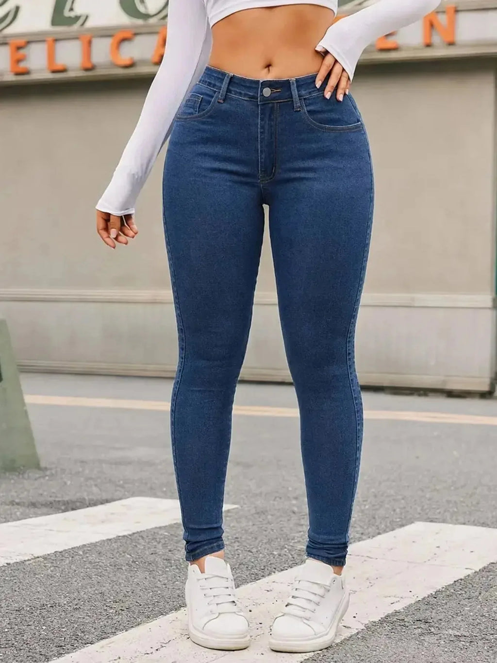 Women's skinny stretch jeans by Nova Mart, fitted denim pants with a sleek, form-fitting design and classic blue wash.