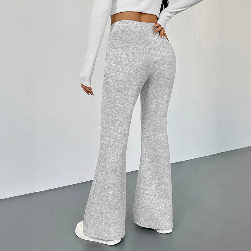 Women's slim fit bootcut trousers by Nova Mart, shown in dark fabric with a tailored waist and classic leg flare.