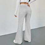 Women's slim fit bootcut trousers by Nova Mart, shown in dark fabric with a tailored waist and classic leg flare.