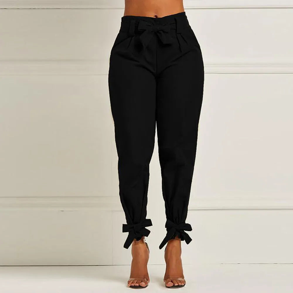 Women's slim-fit tailored pants by Nova Mart, featuring a sleek, fitted design in classic fabric, shown on a model.