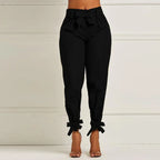 Women's slim-fit tailored pants by Nova Mart, featuring a sleek, fitted design in classic fabric, shown on a model.