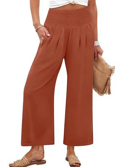 Women's solid-color cropped high-waist pants by Nova Mart, featuring a relaxed fit and stylish high-rise design.