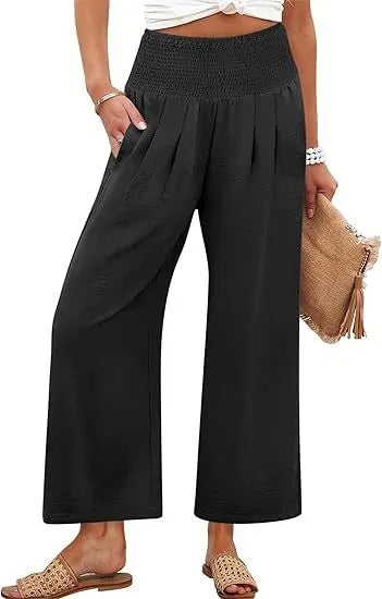 Women's solid-color cropped high-waist pants by Nova Mart, displayed on a model, showcasing the fit and style.