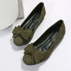 Plus size women's suede bow Gommino flat shoes by Nova Mart, featuring a stylish bow detail and comfortable flat sole.
