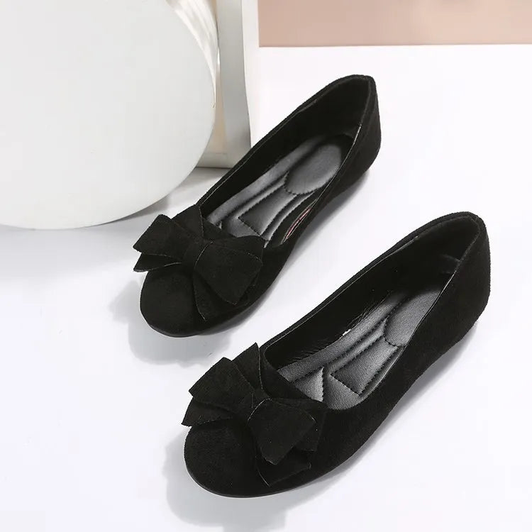 Women's suede bow gommino flat shoes by Nova Mart in plus size, featuring a stylish bow detail and comfortable flat sole.