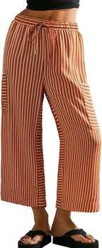 Women’s summer striped straight-leg pants by Nova Mart, featuring lightweight fabric and casual fit, displayed on a hanger.