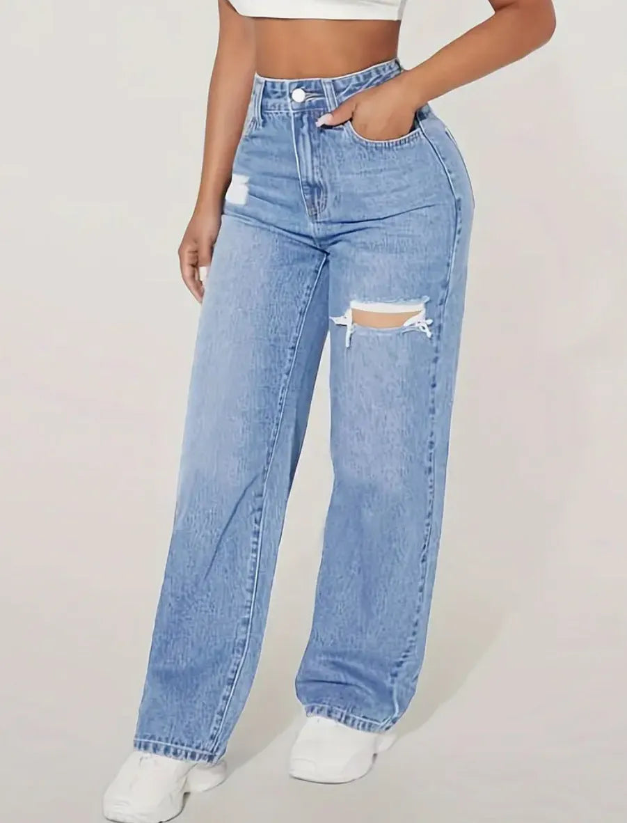 Women’s washed ripped denim jeans by Nova Mart, stylish distressed denim trousers with a relaxed fit and trendy design.