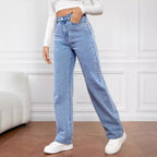 Women's washed straight-leg jeans by Nova Mart displayed on a hanger, showcasing their casual fit and faded denim finish.