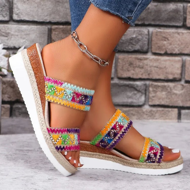 Women's woven wedge sandals with ethnic-style wide straps and a cork heel, by Nova Mart, perfect for casual summer wear.